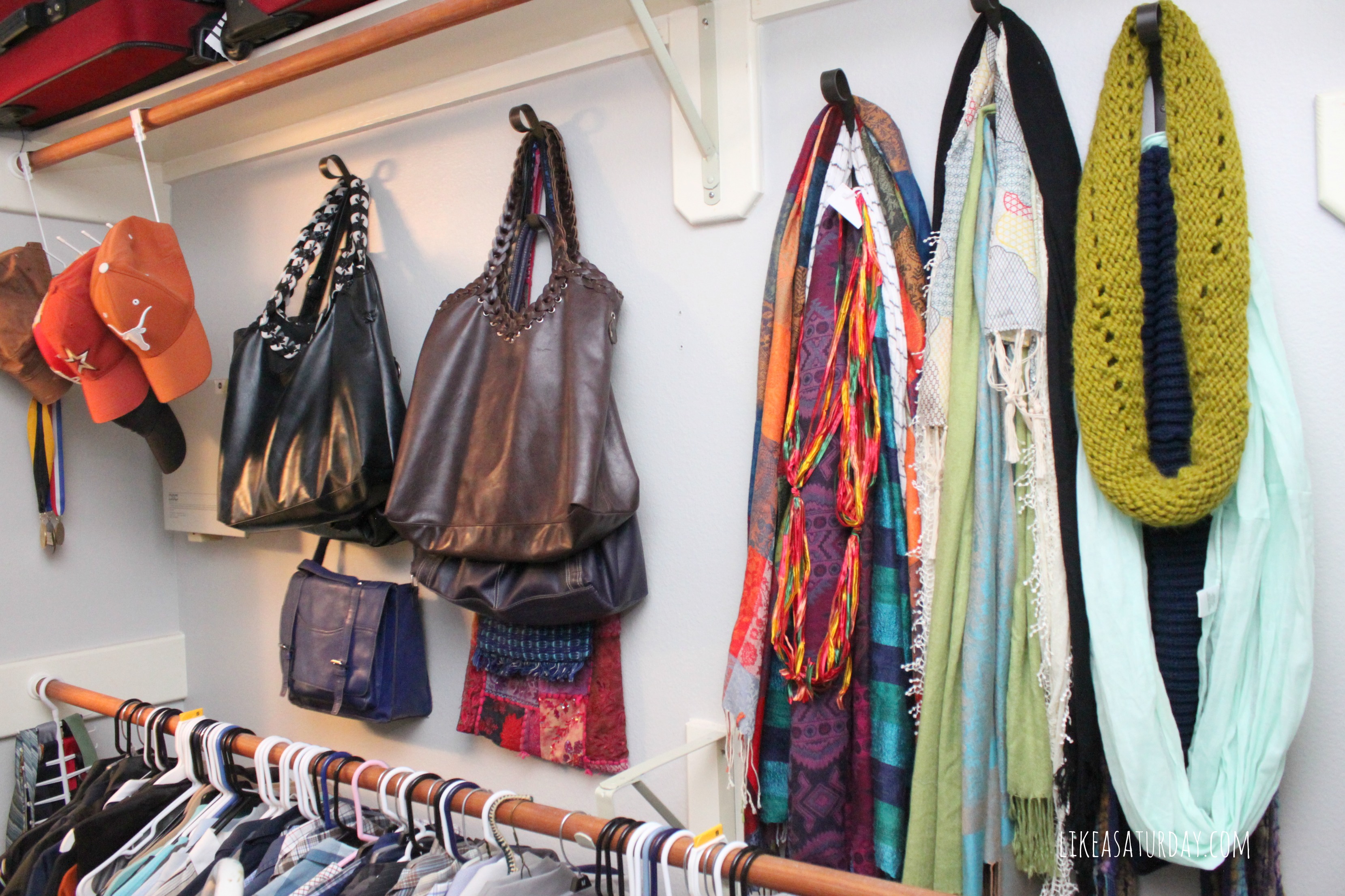 purse organization-hang purses on hooks--via roomandbath.com